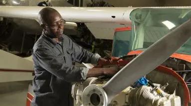 student repairing plain